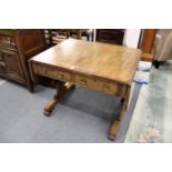 An early 19th century mahogany sofa table with two drawers, the shaped end supports united by a