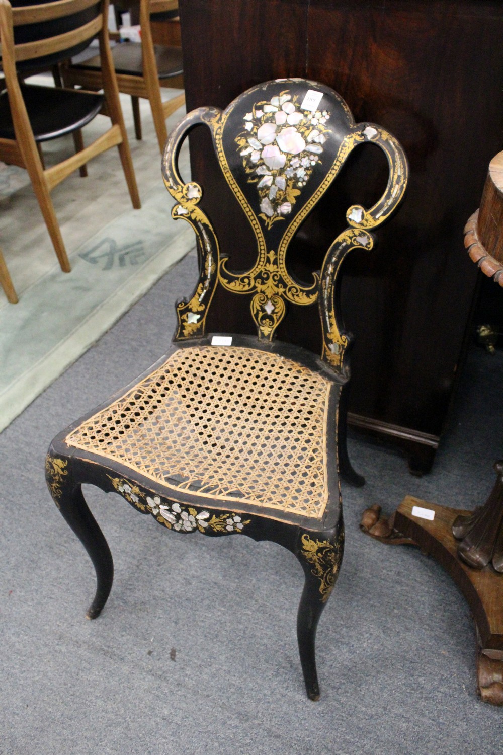 A Victorian papier mache cane seated occasional chair.