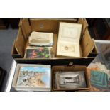 A large quantity of postcards together with a small Victorian photograph album with contents.