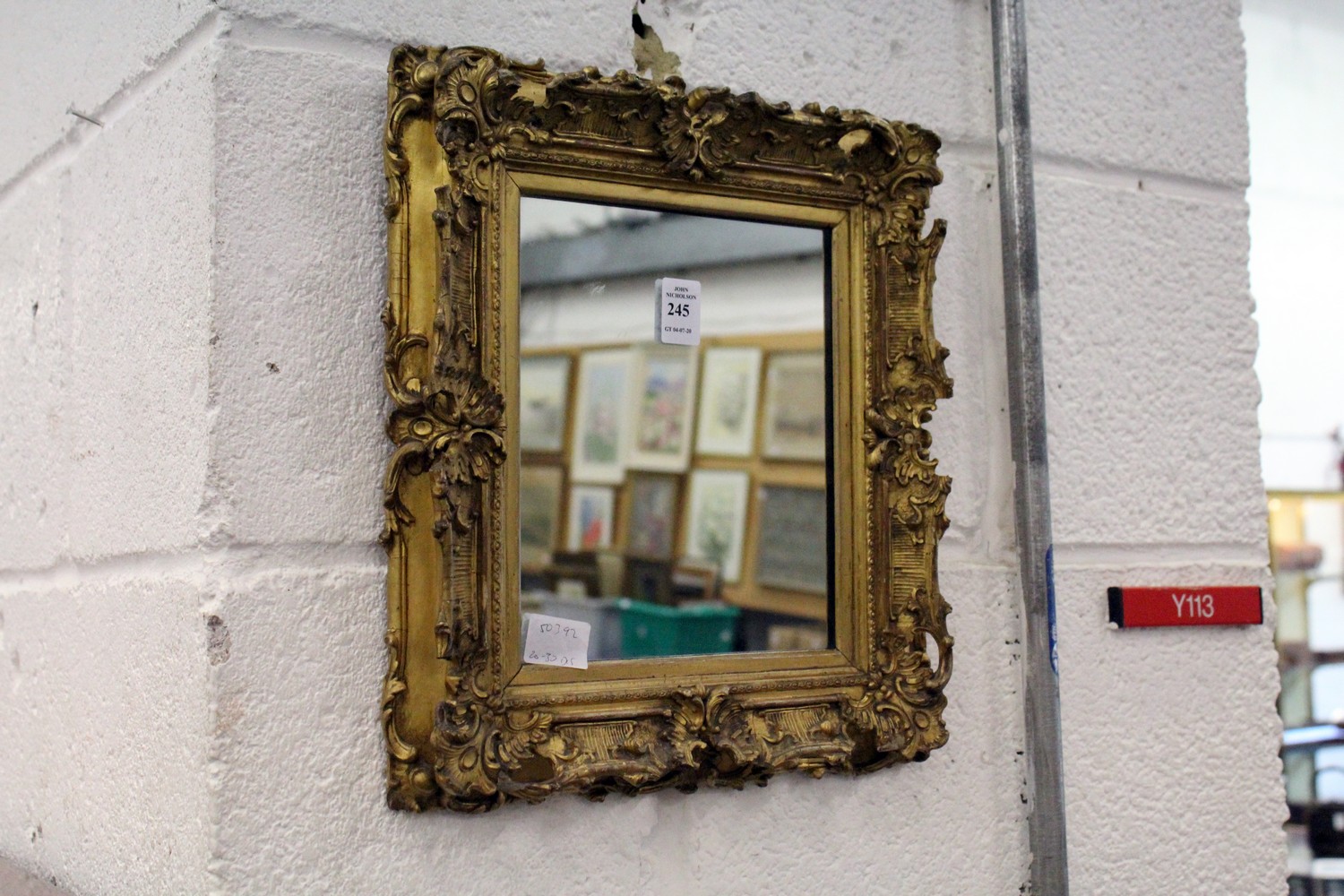 A small decorative gilt framed mirror.