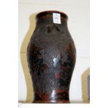 Japanese ceramic vase with incised decoration.