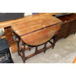 An oak drop leaf gate leg table.