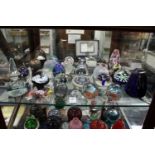 A good collection of glass paperweights.