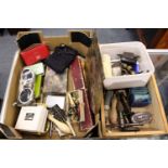 A large quantity of clock parts, tools and other items.