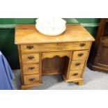 A George III style mahogany kneehole desk.