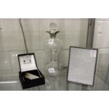 An hour glass decanter with silver collar together with a silver picture frame and Mappin & Webb