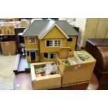 A doll's house with furniture, accessories and other toys.