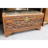 A Chinese carved camphor wood coffer.