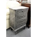 A modern French style small pedestal four drawer chest with embossed silvered decoration.