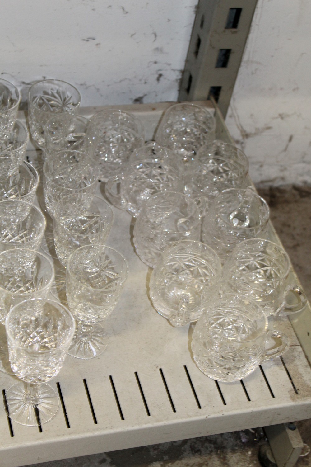 A shelf of cut glass drinking glasses. - Image 5 of 5