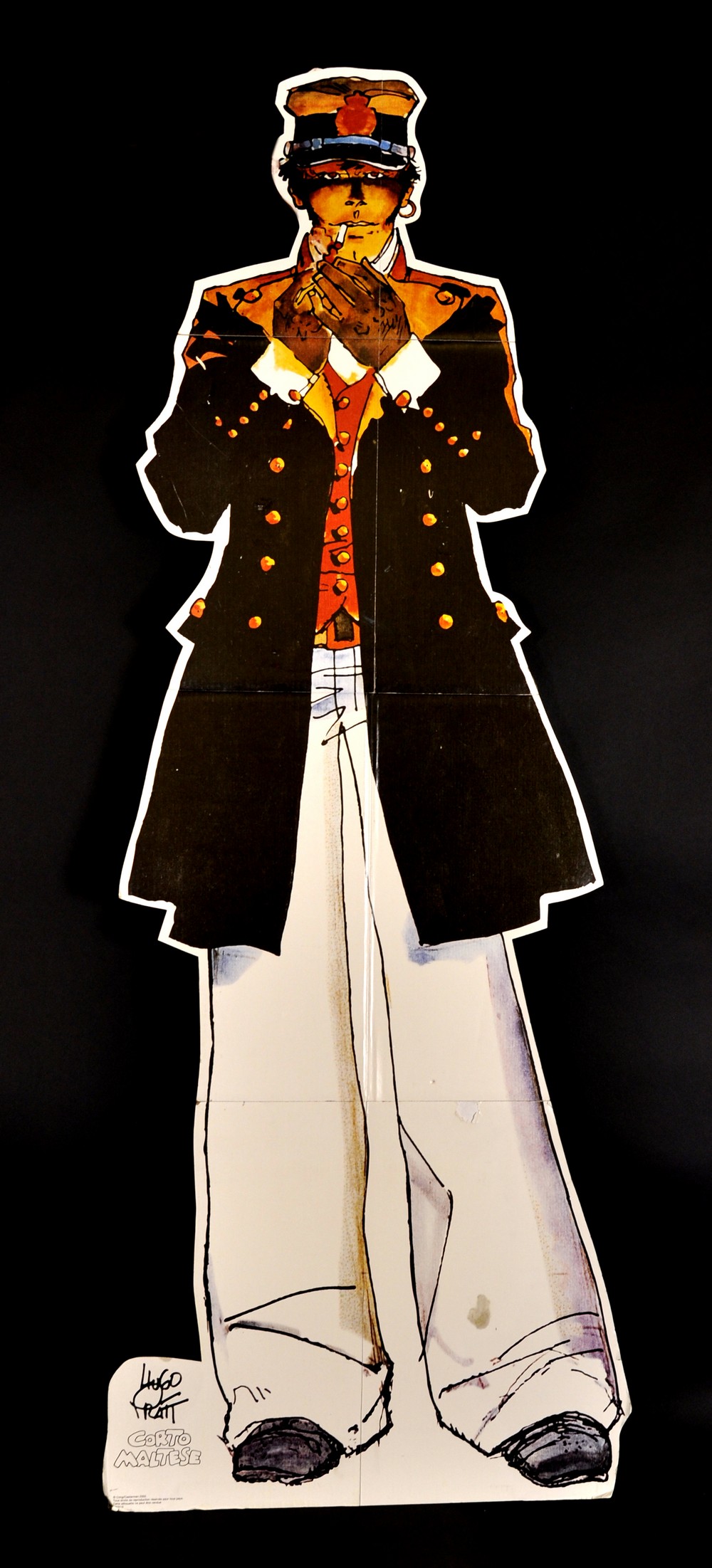 A Cardboard Cut-Out of a Hugo Pratt Figure.