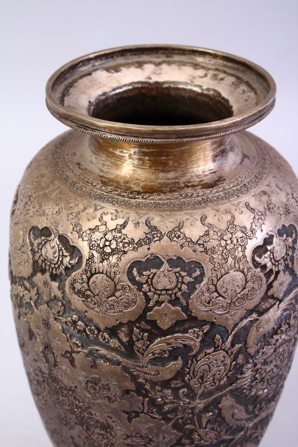 A 18TH / 19TH CENTURY IRANIAN CARVED SILVER VASE, with a multitude of decoration depicting flora and - Image 9 of 12