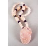 A GOOD CHINESE CARVED ROSE QUARTZ BEAD NECKLACE AND PENDANT, the pendant carved to depict fruit
