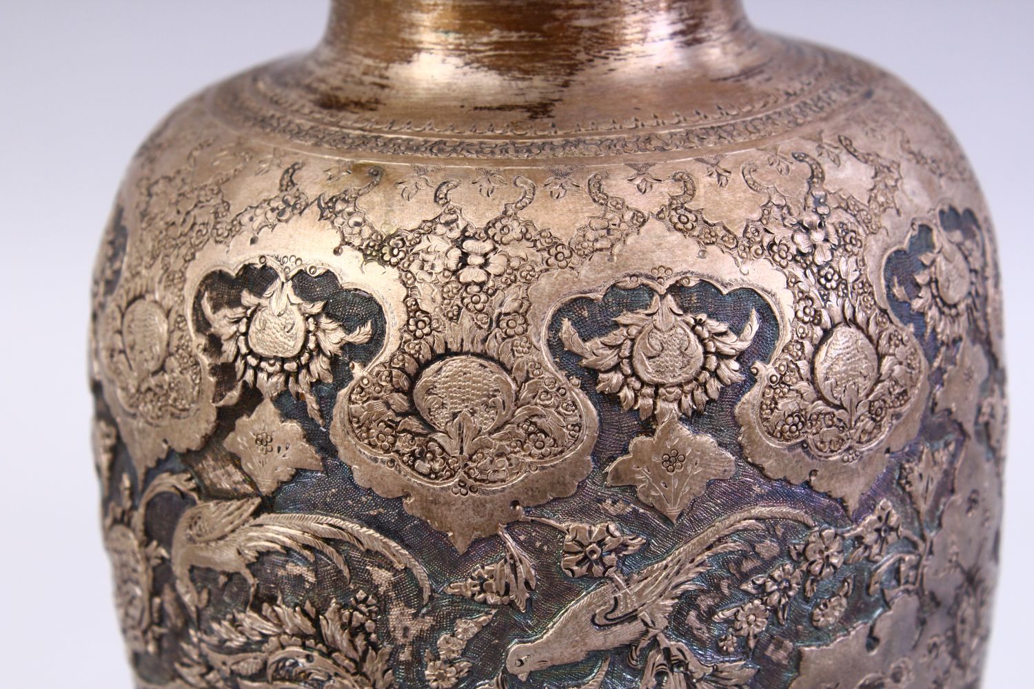A 18TH / 19TH CENTURY IRANIAN CARVED SILVER VASE, with a multitude of decoration depicting flora and - Image 8 of 12