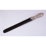 A LARGE TURKISH SILVER AND EBONY PAGE TURNER, the handle with embossed floral decoration, 44cm