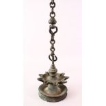 A 17TH / 18TH CENTURY INDIAN INSCRIBED BRONZE HANGING OIL LAMP, 14.5cm diameter.