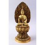 A GOOD CHINESE BRONZE FIGURE OF GUANYIN, seated in a meditating position, upon a lotus base with a