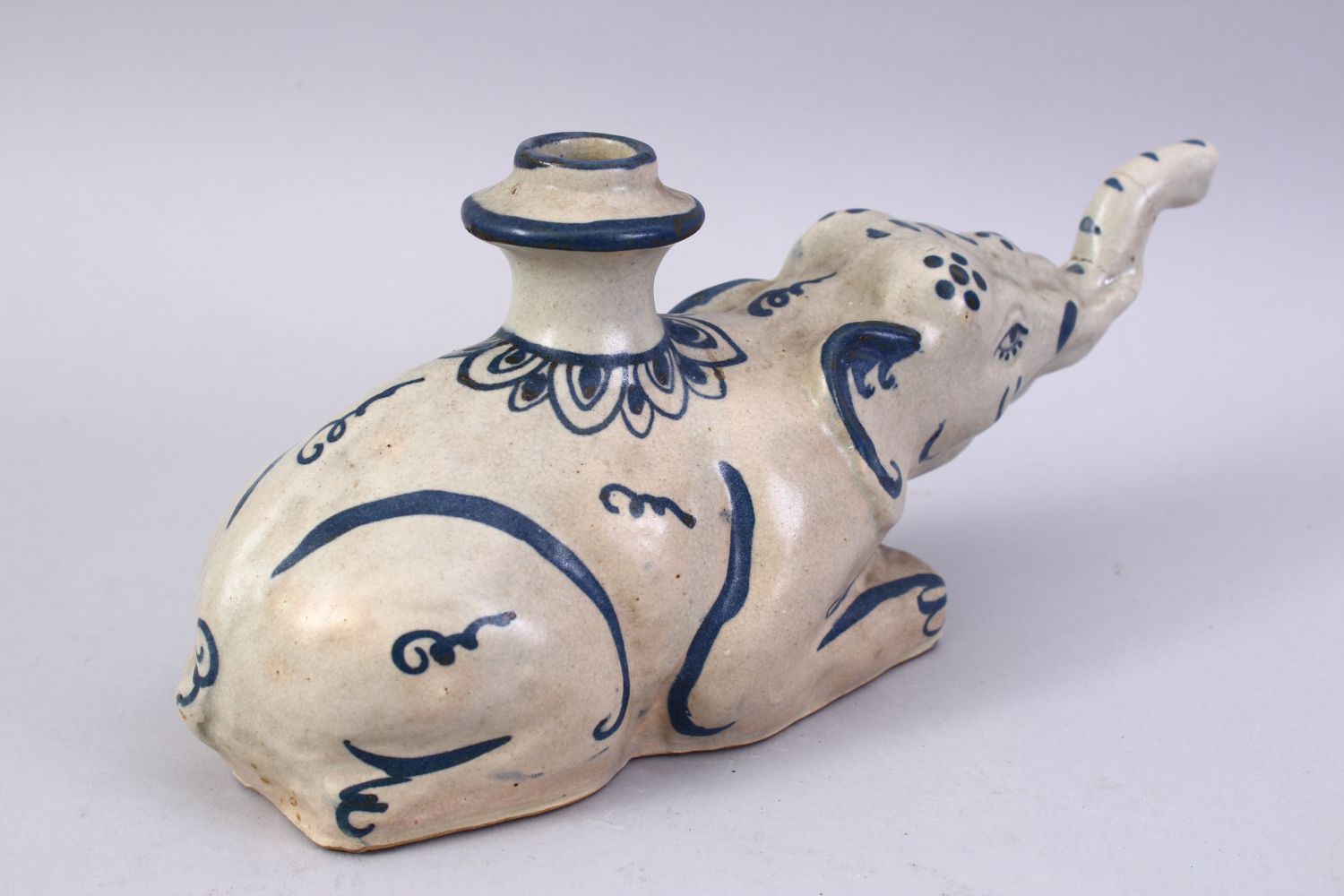 AN UNUSUAL 19TH CENTURY INDIAN POTTERY HUQQA BASE, in the form of a recumbent elephant, 28cm long. - Image 3 of 7