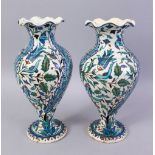 A PAIR OF 19TH CENTURY TURKISH OTTOMAN KUTAHIYA BALUSTER SHAPE VASES, painted in the Iznik style,