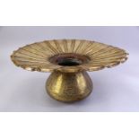 A LARGE ISLAMIC ENGRAVED BRASS BASIN, with engraved broad rim and bulbous body, 40cm diameter.