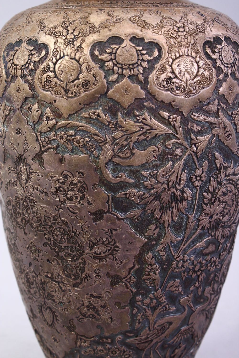 A 18TH / 19TH CENTURY IRANIAN CARVED SILVER VASE, with a multitude of decoration depicting flora and - Image 6 of 12