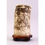 A GOOD JAPANESE MEIJI PERIOD CARVED IVORY TUSK VASE SECTION, the section carved in relief to