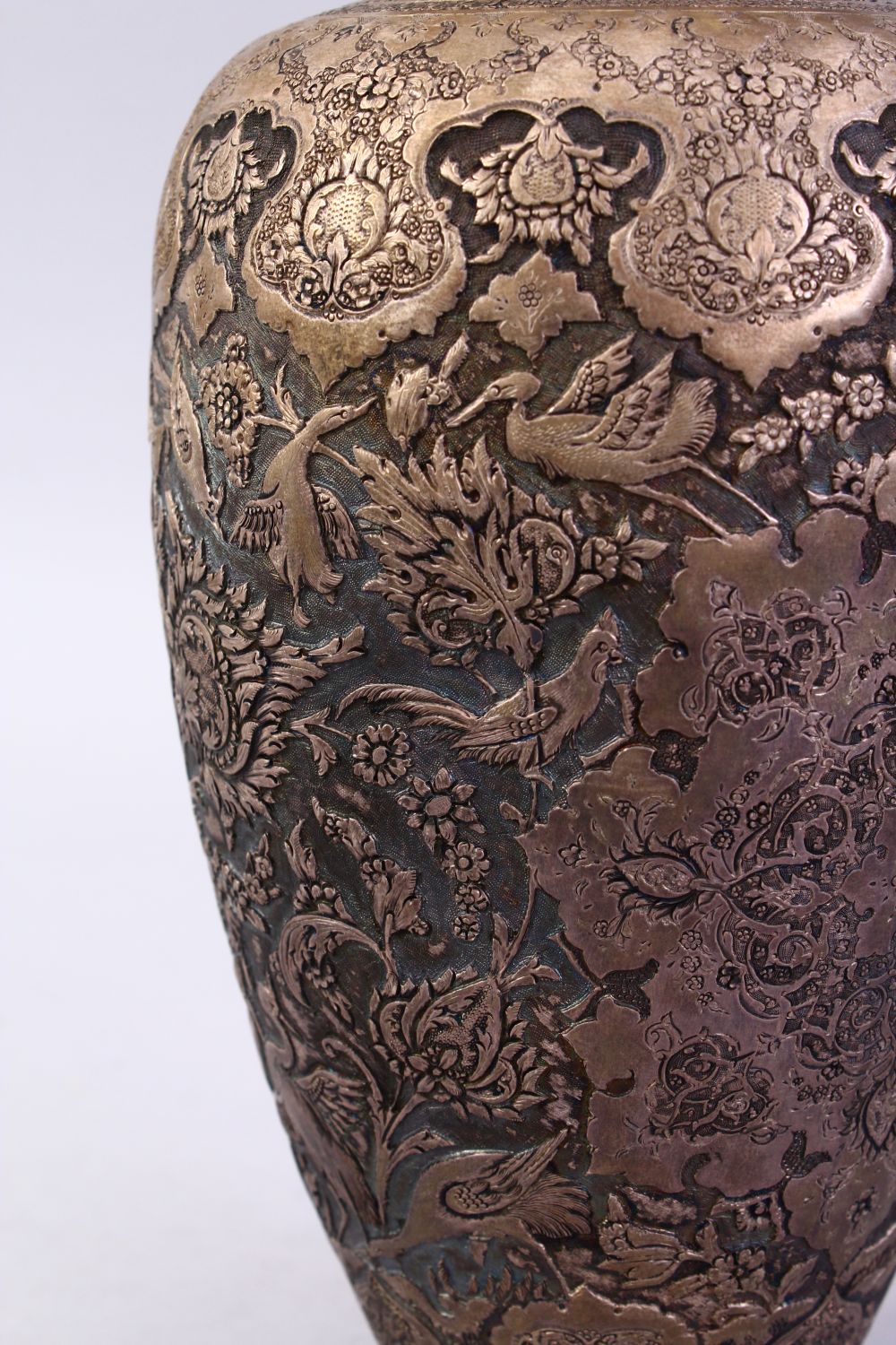 A 18TH / 19TH CENTURY IRANIAN CARVED SILVER VASE, with a multitude of decoration depicting flora and - Image 5 of 12