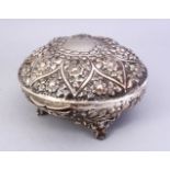 A GOOD 19TH CENTURY ISLAMIC SILVER LIDDED BOX, the box stood on four feet, with a hinged lid, floral