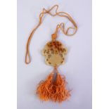 A GOOD CHINESE CARVED JADE PENDANT, depicting a floral spray of flora with silk tie, 5.5cm.