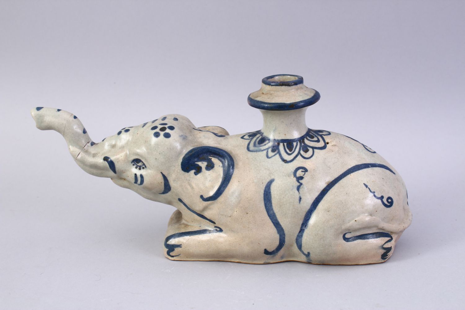AN UNUSUAL 19TH CENTURY INDIAN POTTERY HUQQA BASE, in the form of a recumbent elephant, 28cm long. - Image 2 of 7