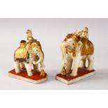 TWO INDIAN POLY CHROME CARVED MARBLE FIGURES OF ELEPHANTS AND RIDERS, both elephants in striding