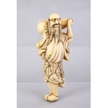 A JAPANESE EDO PERIOD CARVED IVORY NETSUKE OF A SENNIN, stood looking aloft holding a double gourd