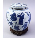 AN EARLY 20TH CENTURY CHINESE BLUE & WWHITE PORCELAIN GINGER JAR & COVER + STAND, decorated with