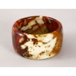 A 19TH / 20TH CENTURY CARVED CHINESE SOAP / HARD STONE BANGLE, 8cm diameter, 6.3cm internal.