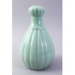 A GOOD CHINESE CELADON GARLIC HEAD PORCELAIN VASE, with a ribbed body, base with a six character