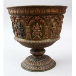 A 19TH CENTURY INDIAN TANJORE SILVER & COPPER OVERLAID BRASS JARDINIERE, with moulded god
