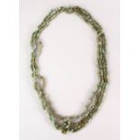 A GOOD CHINESE CARVED JADE / HARD STONE BEAD NECKLACE, with seven runs of beads, Approx 55cm.