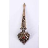 A GOOD 19TH CENTURY INDIAN TURBAN CLIP, with carved floral decoration and inset stones, 10cm