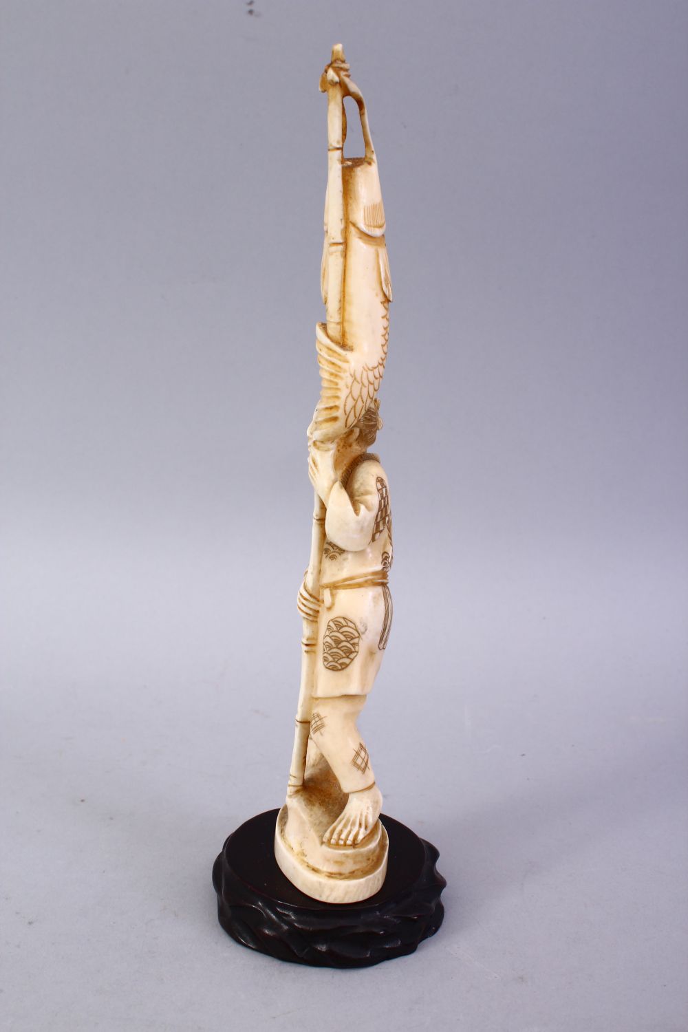 A JAPANESE MEIJI PERIOD CARVED IVORY OKIMONO - FISHERMAN, The man stood holding his rod and catch, - Image 6 of 9