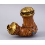AN OTTOMAN PORCELAIN PIPE BOWL, with hinged brass cover, the inset with semi precious stones, 10cm