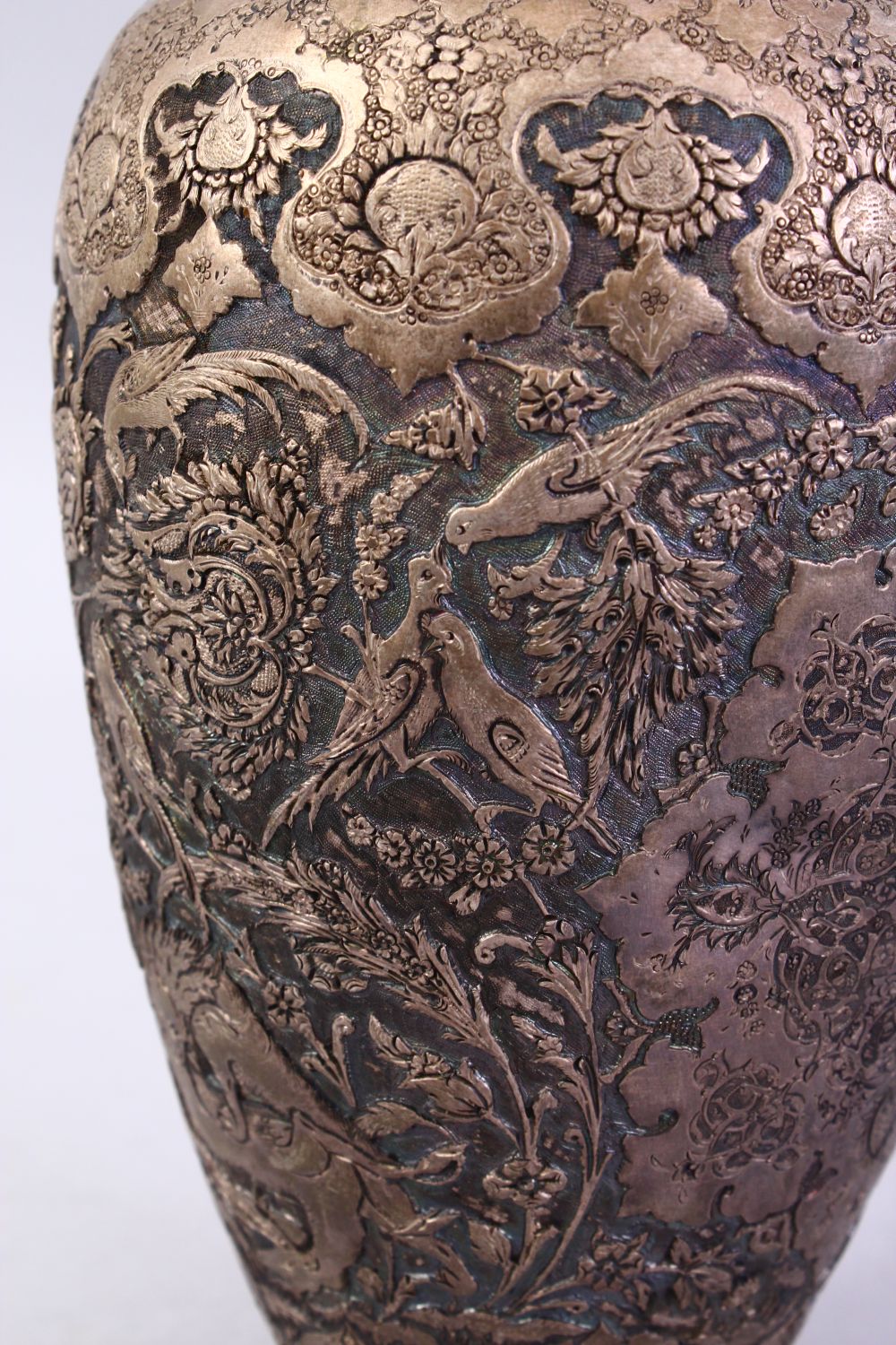 A 18TH / 19TH CENTURY IRANIAN CARVED SILVER VASE, with a multitude of decoration depicting flora and - Image 7 of 12