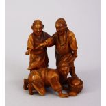 A FINE QUALITY JAPANESE MEIJI PERIOD CARVED IVORY OKIMONO - THREE FISHERMAN, the three men stood