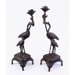 A GOOD PAIR OF JAPANESE MEIJI PERIOD BRONZE EGRET / CRANE CANDLESTICKS, both stood holding the