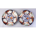 TWO GOOD JAPANESE MEIJI PERIOD IMARI CHARGERS, decorated with panels of landscapes and birds,