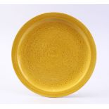 A GOOD CHINESE YELLOW GROUND INCISED PORCELAIN DRAGON SAUCER, the saucer incised with decoration