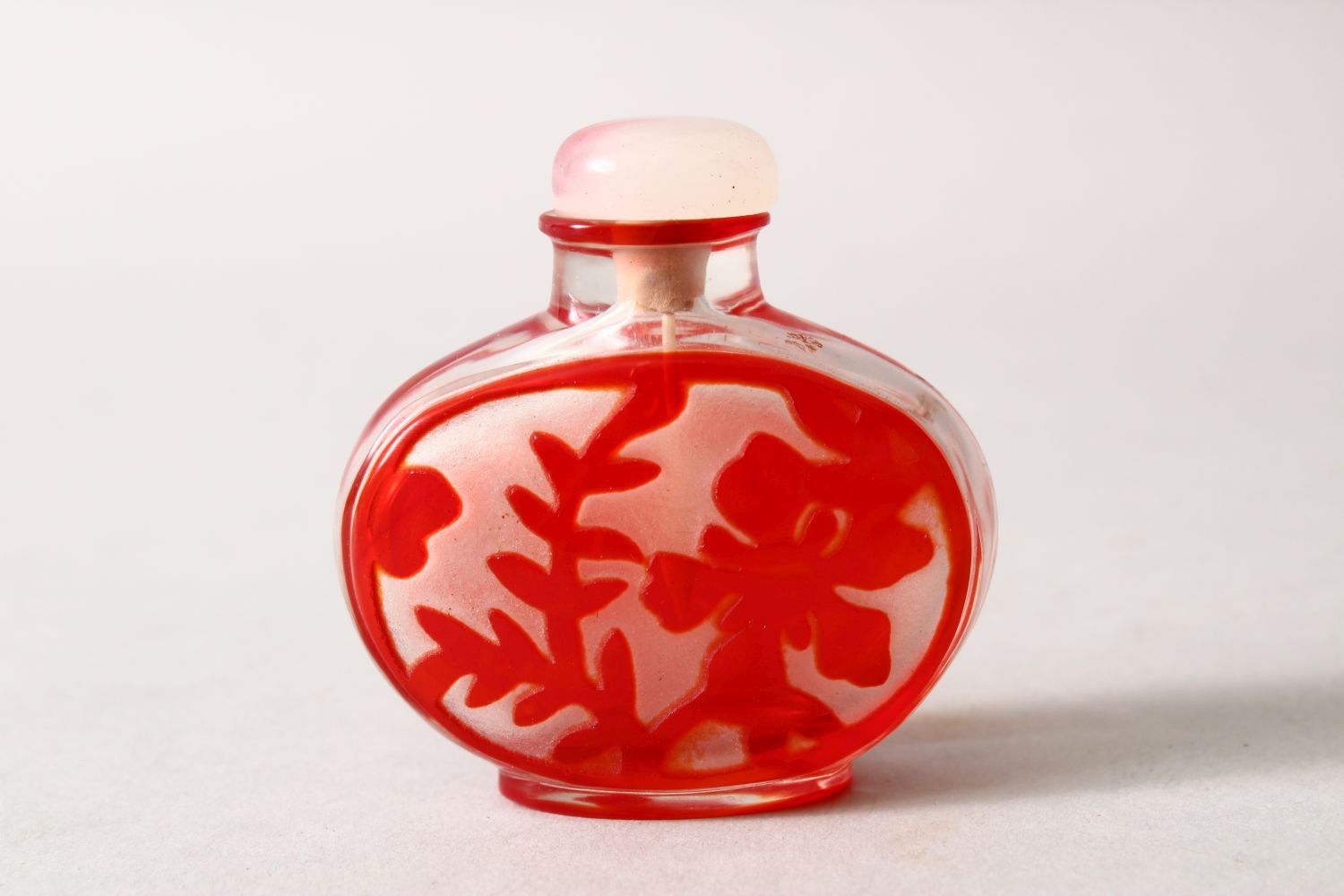 A19TH / 20TH CENTURY CHINESE RED OVERLAY GLASS SNUFF BOTTLE, depicting kylin and flora, with hard - Image 2 of 3