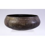 A SMALL MAMLUK BRONZE CALLIGRAPHIC BOWL. the body with carved calligraphy and foliate borders,