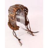 A GOOD 19TH CENTURY OTTOMAN OR INDIAN LEATHER & SILVER BEAD HEAD DRESS, with inset sapphire style