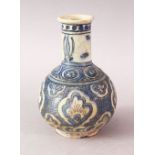 A GOOD ISLAMIC SAFAVID POTTERY VASE, with panels of stylized flora upon blue glaze, 18cm high.