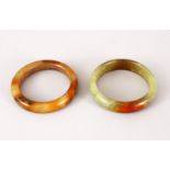 TWO 19TH / 20TH CENTURY CHINESE CARVED JADE BANGLES, both 8.5cm & internal 6cm & 6.5cm
